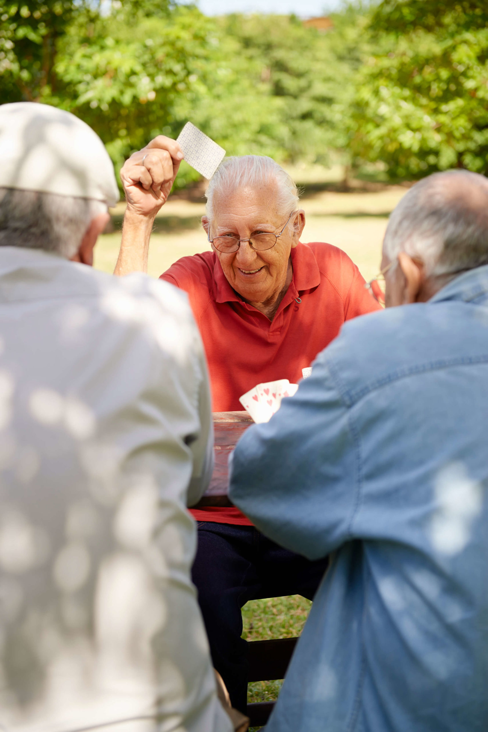 Residents engaged in group activities, including board games, puzzles, and arts and crafts.